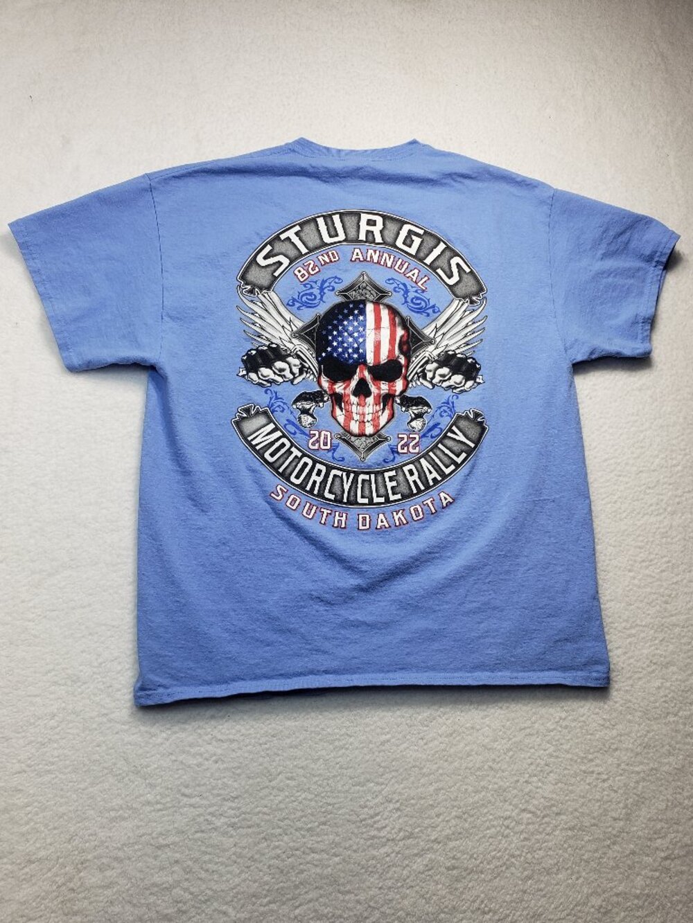 Sturgis Black Hills Rally 2022 82nd Anniversary Skull Wings Flag T-Shirt XL Blue